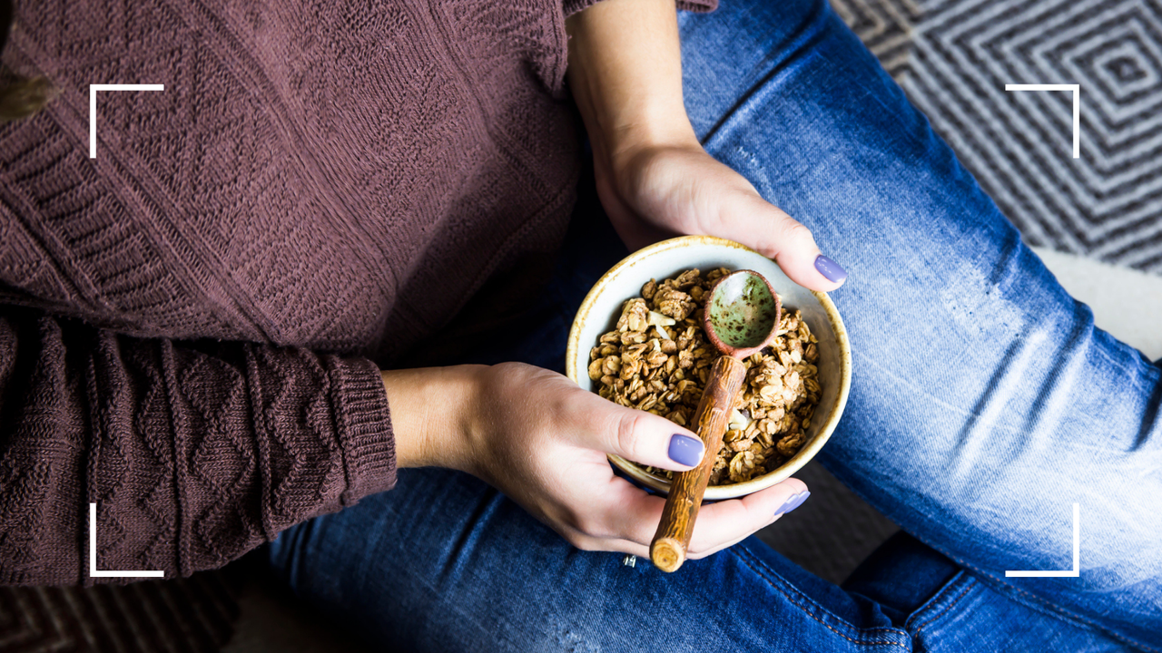 Woman eating bowl of muesli