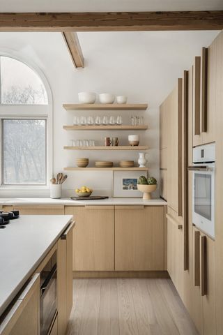 kitchen with blonde wood cabinets and a Japandi aesthetci