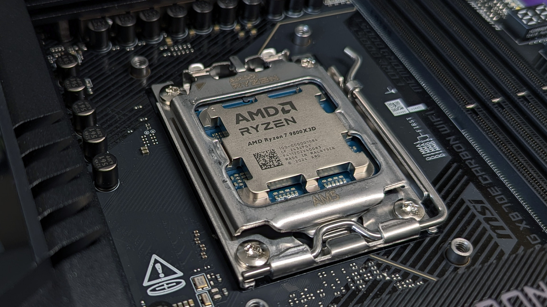 AMD Ryzen 7 9800X3D processor in motherboard socket