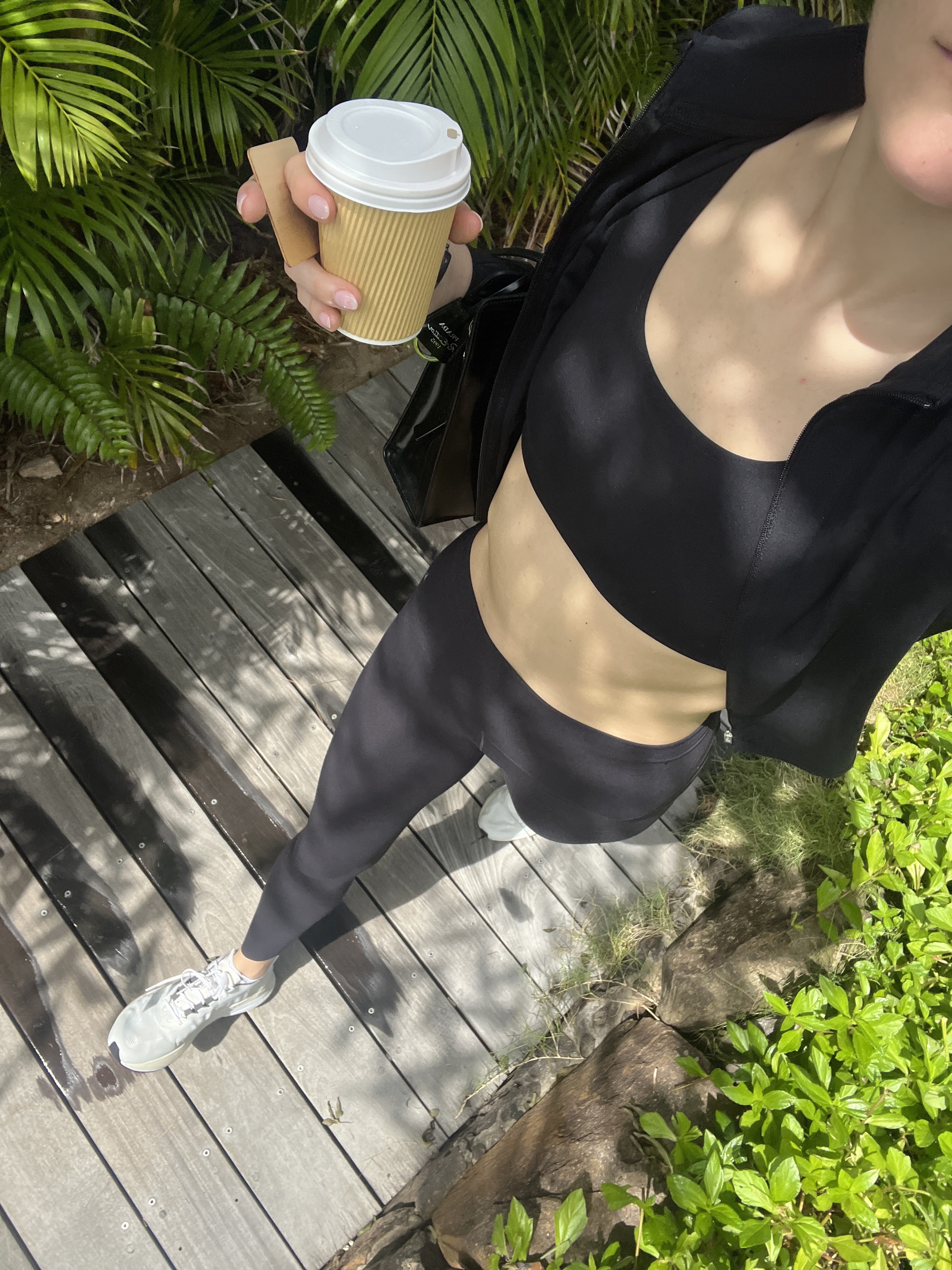 Eliza Huber wearing a Nike sports bra and leggings set to do yoga.