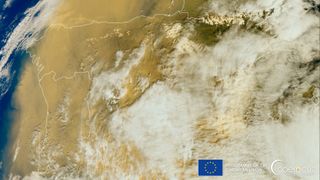 A massive cloud of Saharan dust stirred up by a storm is covering large portions of Western Europe in this image by the European Sentinel 3 satellite.