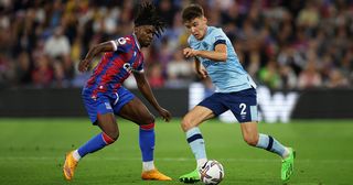 Aaron Hickey of Brentford is put under pressure by Eberechi Eze of Crystal Palace during the Premier League match between Crystal Palace and Brentford FC at Selhurst Park on August 30, 2022 in London, England.