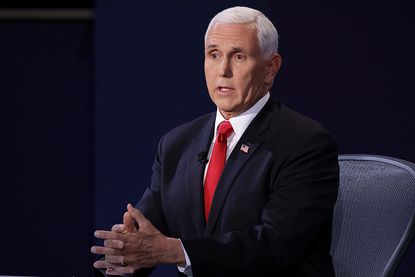 Pence speaks at the debate.