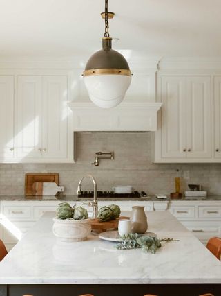 a transitional kitchen with a covered hood