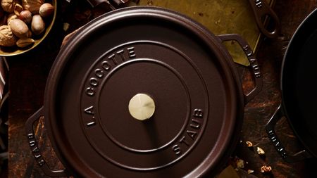 A deep brown cast-iron Dutch oven viewed from above.