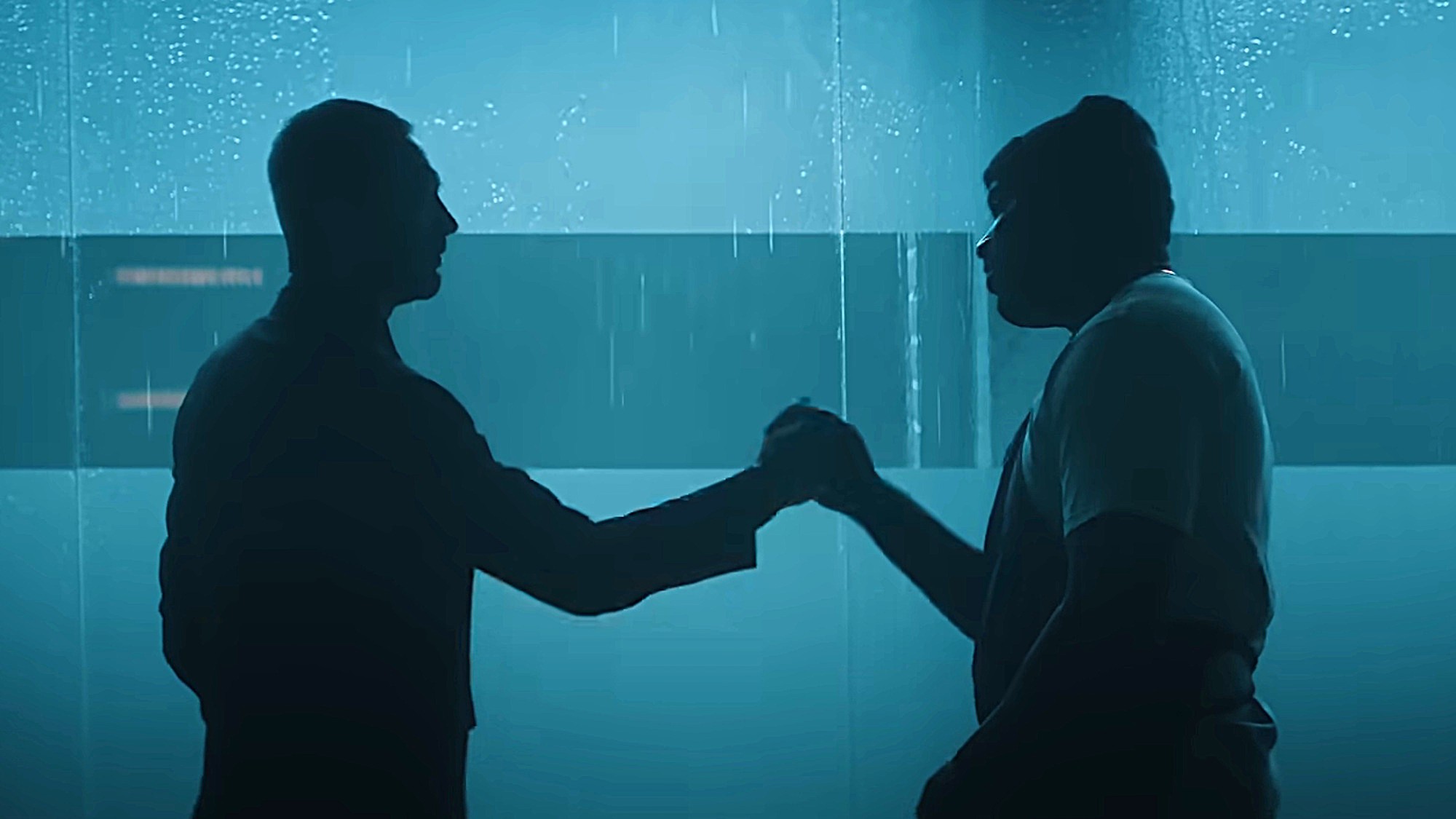 Richie and Marcus (Ebon Moss-Bachrach and Lionel Boyce) are silhouetted as they fist-bump on The Bear.