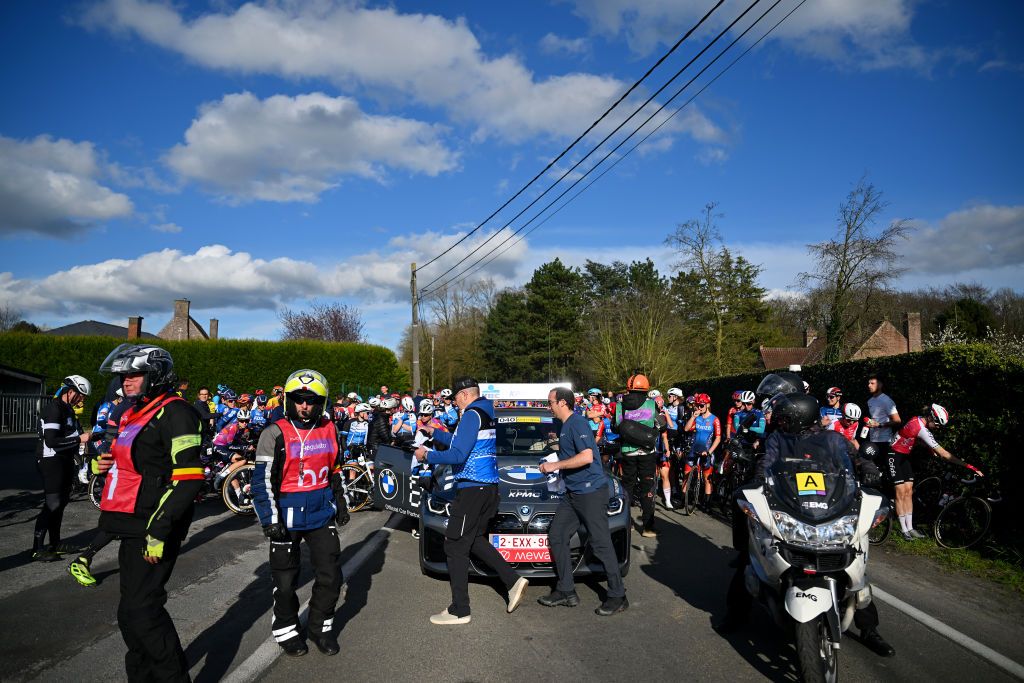 WAREGEM BELGIUM MARCH 27 The womens peloton is stopped due to a twocar accident after the mens race there will be no climb of the Knokteberg Trieu during the 12nd Dwars door Vlaanderen 2024 Womens Elite a 1299km one day race from Waregem to Waregem on March 27 2024 in Waregem Belgium Photo by Luc ClaessenGetty Images