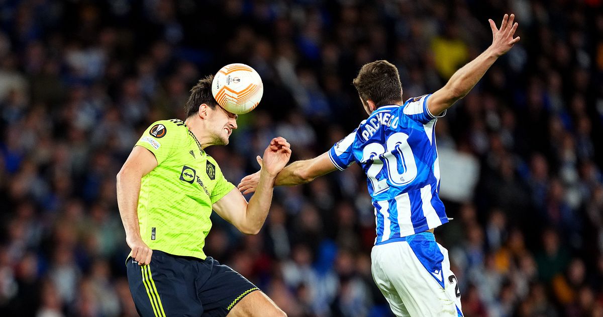 Manchester United captain Harry Maguire and Jon Pacheco of Real Sociedad compete for a header during the UEFA Europa League group E match between Real Sociedad and Manchester United at Reale Arena on November 03, 2022 in San Sebastian, Spain.