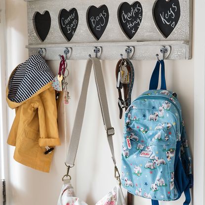 cloth bag and key on wall key stand