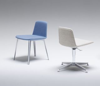 A blue office chair without wheels is to the left, and a beige office chair with wheels is to the right.