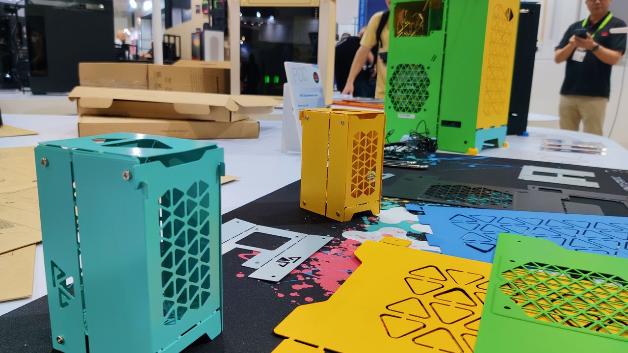 InWins POC cases little samples and unfolded side panels with the original versions in the background.