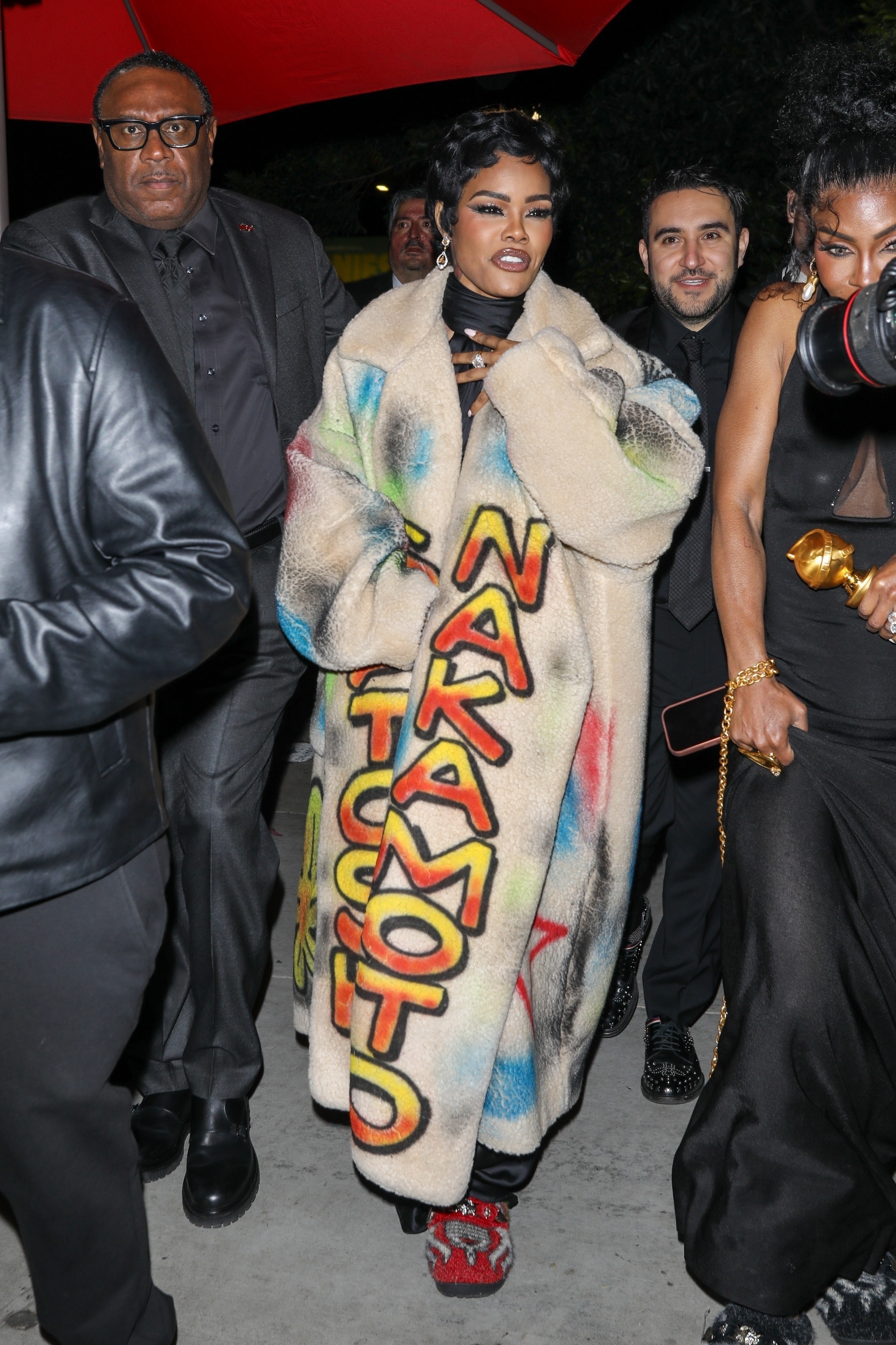 Teyana Taylor at the 2026 Golden Globes after-party wearing a Satoshi Nakamoto coat