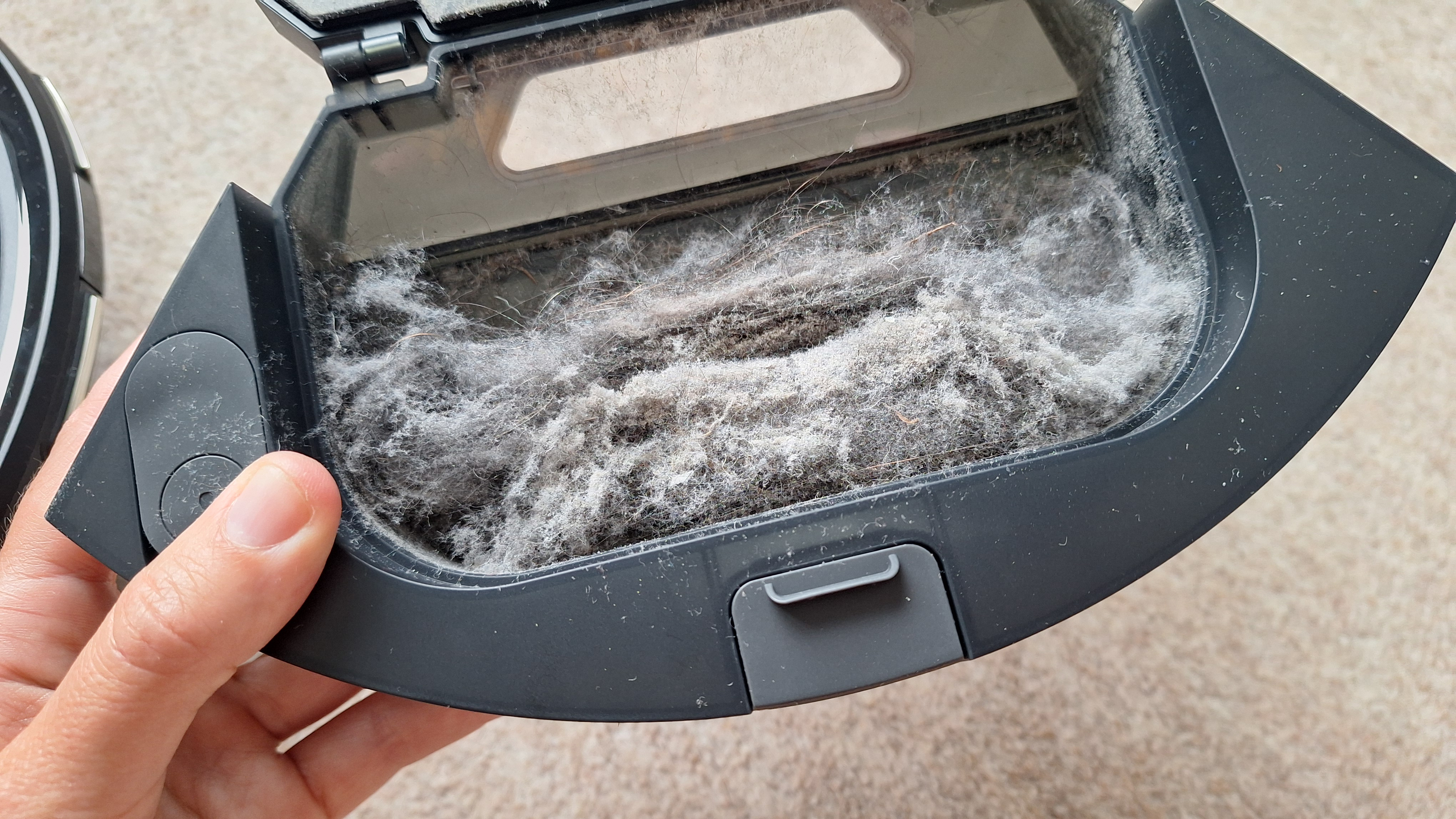 Roborock Q7 M5 dust bin full of dog hair and dust