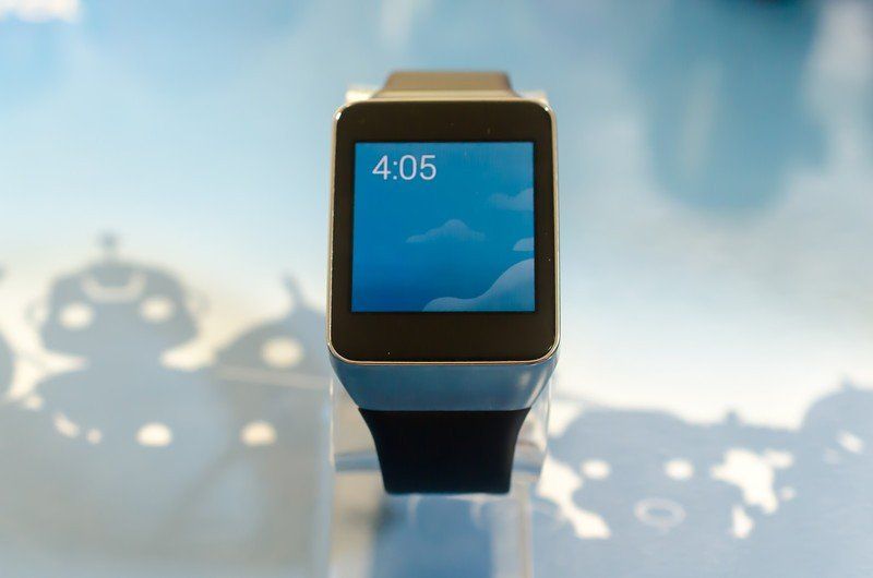 The Simple watch face is a digital display against a backdrop of clouds