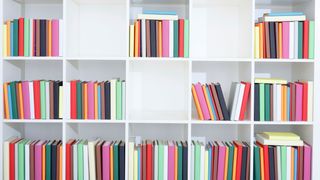 Best drawing books: selection of colourful books on bookshelves