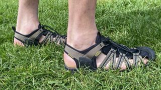 Man wearing Keen Drift Creek H2 sandals on grass