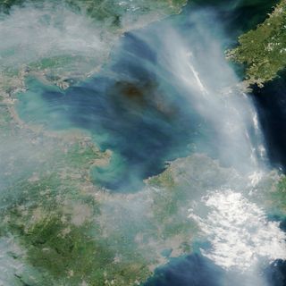 Smoke from Tianjin explosions, seen from space.