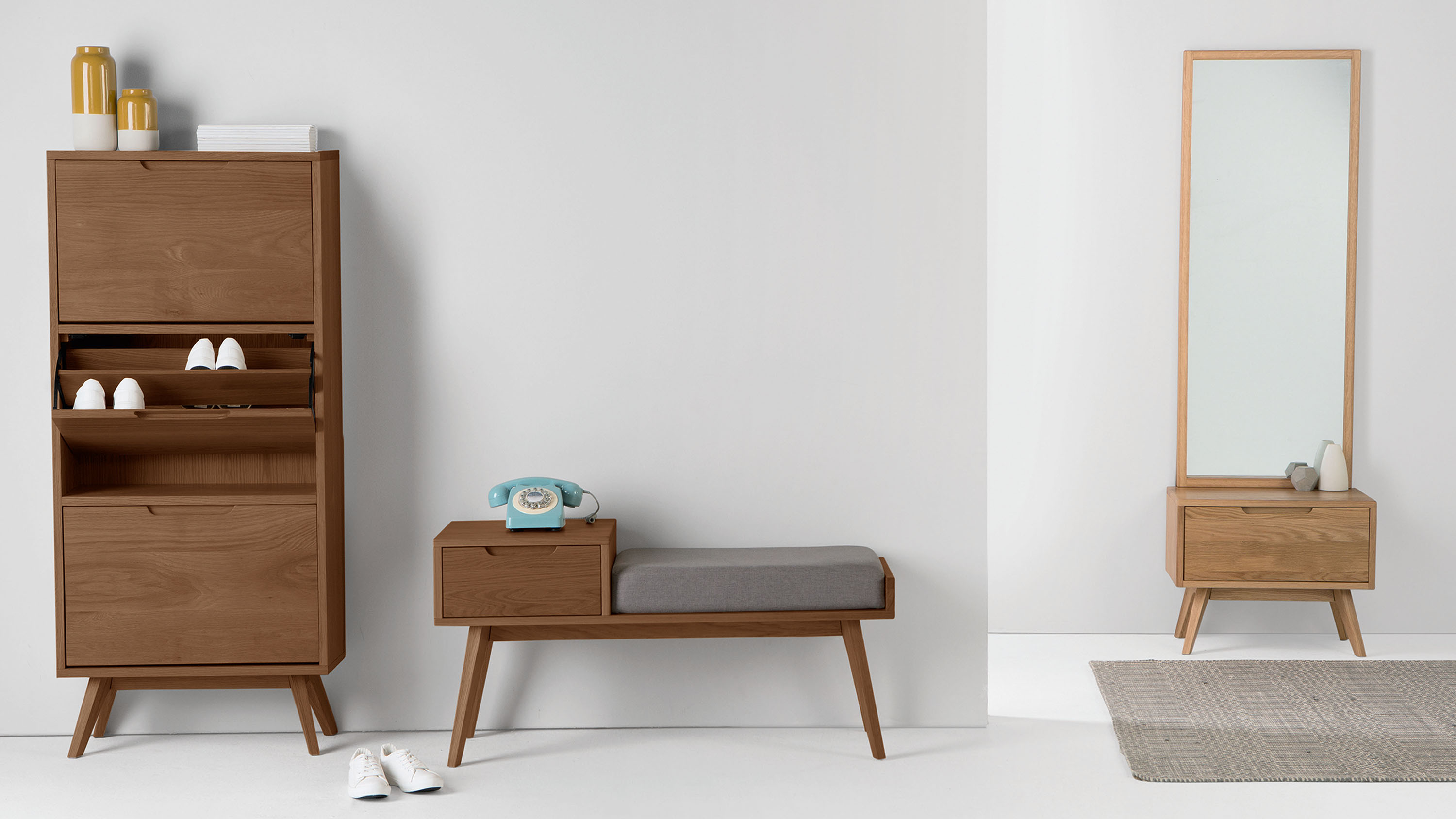 Telephone table, shoe cabinet and storage mirror in a hall