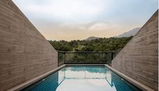 Yanbai Villa's infinity pool overlooking the Chinese landscape 