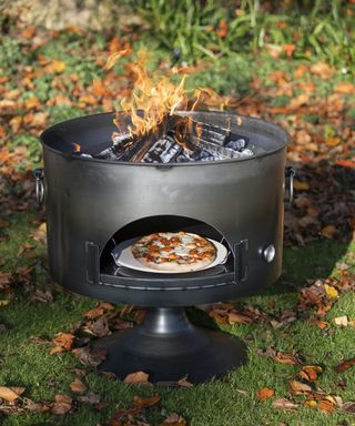 Firepit with a compartment for cooking pizza