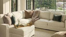 A large, cream sofa from Lovsac.