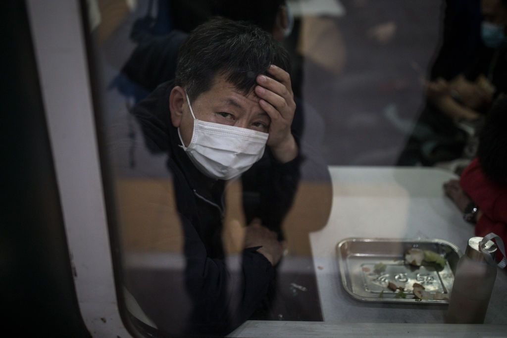 Man on train in Wuhan, China