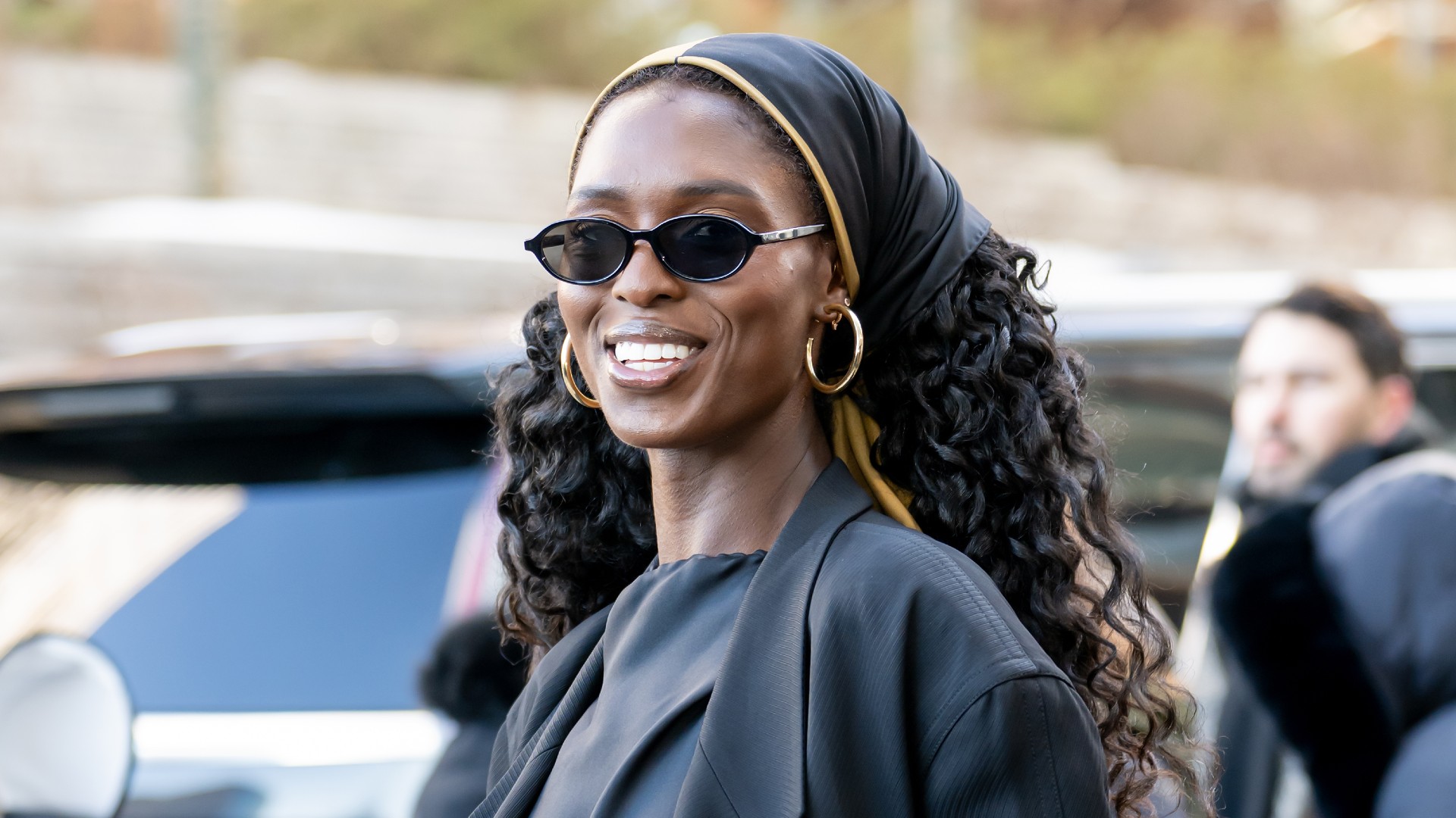 a black woman with long, curly hair