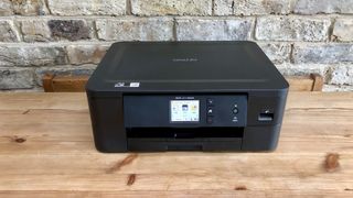 Brother MFC-J1170DW/DCP-J1140DW (US/UK) on a wooden table for home office use