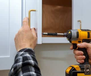 fitting a handle to kitchen cabinet door