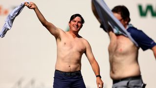 Joel Dahmen and Harry Higgs of the United States take their shirts off on the 16th hole during the final round of the WM Phoenix Open at TPC Scottsdale on February 13, 2022 in Scottsdale, Arizona.