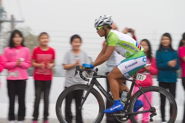 Local hero Feng Chun Kai from Action Cycling Team chasing points for the KOM competition