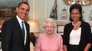 President Barack Obama and his wife, Michelle Obama pose with Queen Elizabeth II at a reception at Buckingham Palace