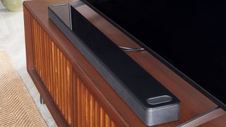 The Bose Smart Ultra Soundbar underneath a TV.