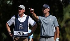 Paul Casey speaks to his caddie during LIV Golf Miami