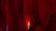 Members of the Royal Brotherhood of the Holy Christ of the Insults take part in a Holy Wednesday Silence Procession in Zamora, Spain