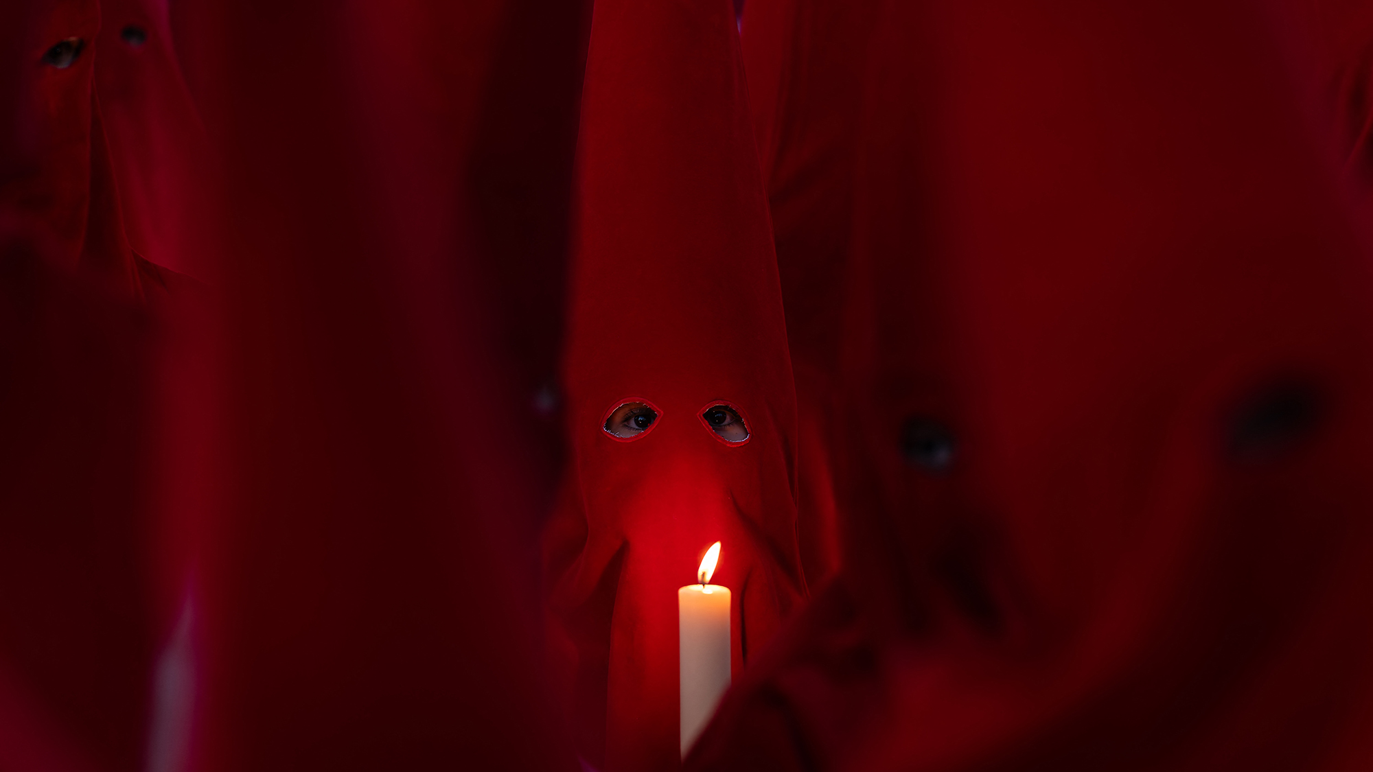 Members of the Royal Brotherhood of the Holy Christ of the Insults take part in a Holy Wednesday Silence Procession in Zamora, Spain