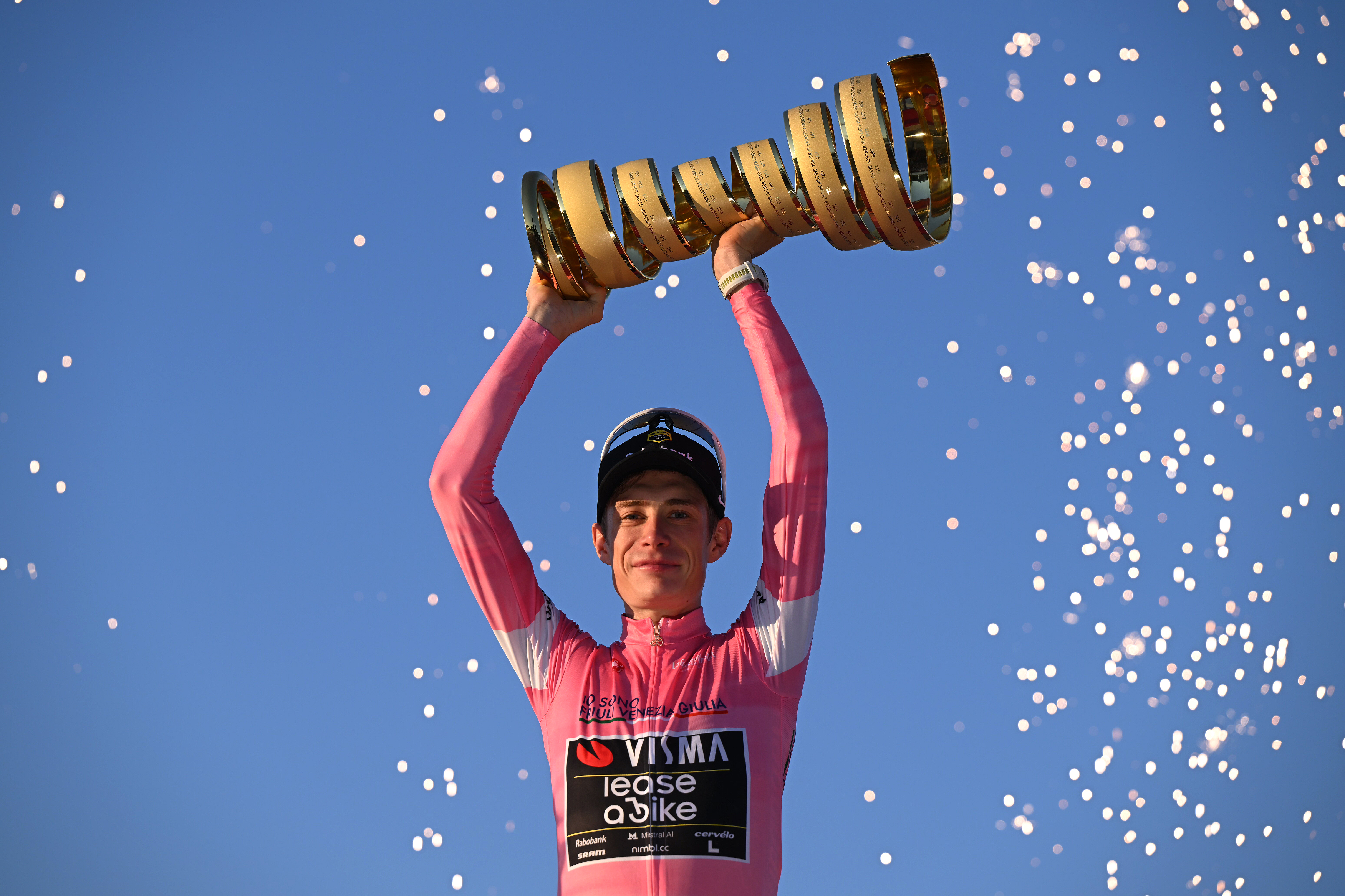 ROME, ITALY - MAY 31: Jonas Vingegaard of Denmark and Team Visma | Lease a Bike celebrates at podium as Pink Leader Jersey and overall race winner with the Trofeo Senza Fine during the 109th Giro d&amp;apos;Italia 2026, Stage 21 a 131km stage from Rome to Rome 1289m / #UCIWT / on May 31, 2026 in Rome, Italy. (Photo by Dario Belingheri/Getty Images)