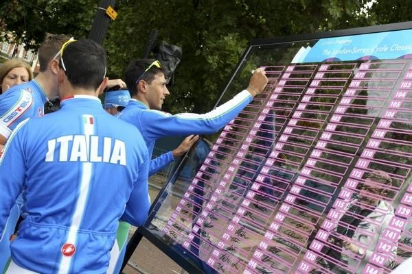 The Italian team sign on.