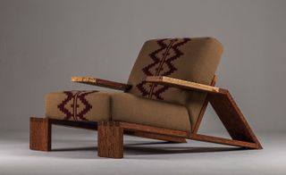 Low lounge chair made of wood with textile upholstery by Cristián Mohaded