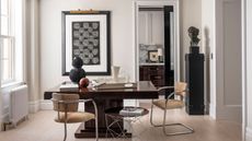 dining room with cream walls dark table and chrome framed chairs