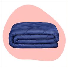 Blue weighted blanket on pink background