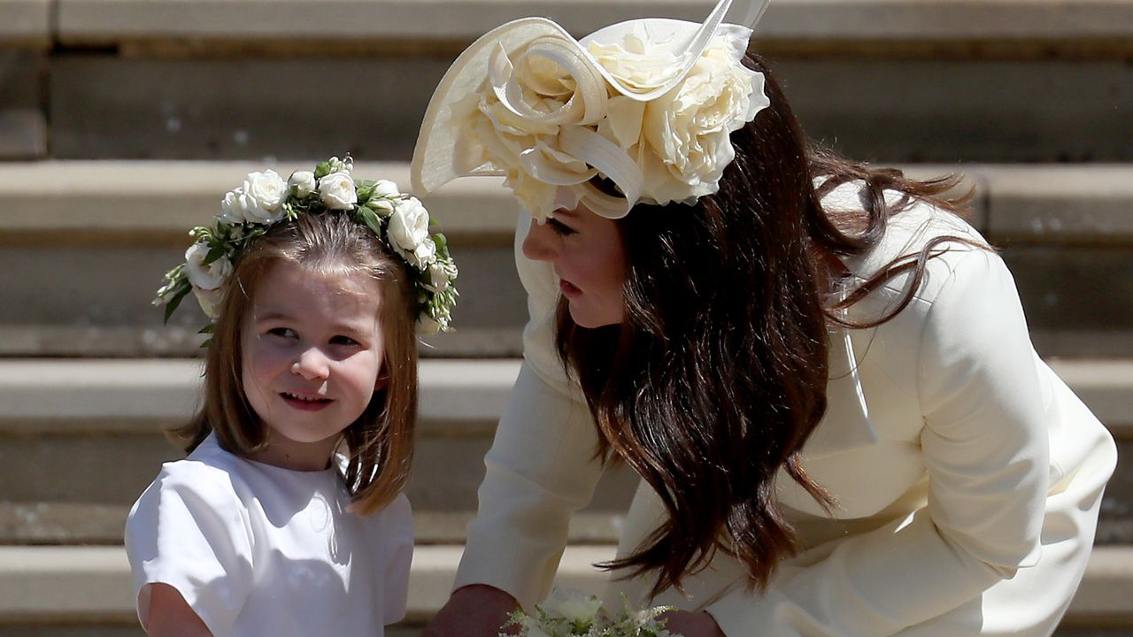 Princess Charlotte of Cambridge stands on the steps with her mother Catherine, Duchess of Cambridge after the wedding of Prince Harry and Ms. Meghan Markle at St George&#039;s Chapel at Windsor Castle on May 19, 2018 in Windsor, England