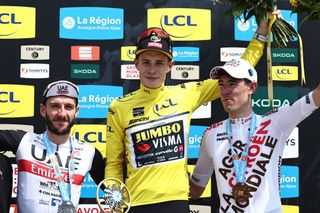 Adam Yates, Jonas Vingegaard, and Ben O’Connor on the final podium of the 2023 Critérium du Dauphiné