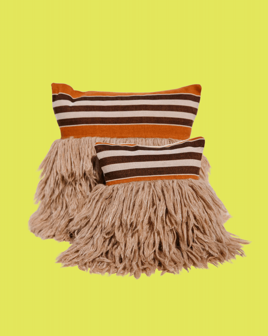 Ifsthatic Wugo Throw Pillow in Rust Stripe/Andes Sand in a rotating gif.