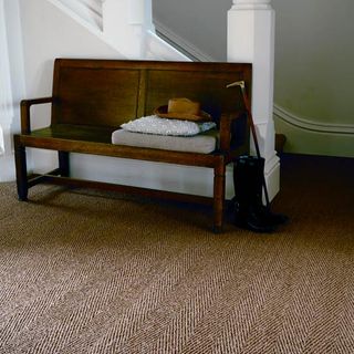 room with white wall and carpet