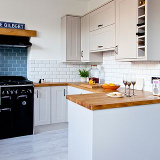 kitchen with cabinets and wooden worktop