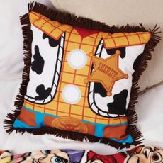 woody cushion in square shape with brown and yellow cartoon design
