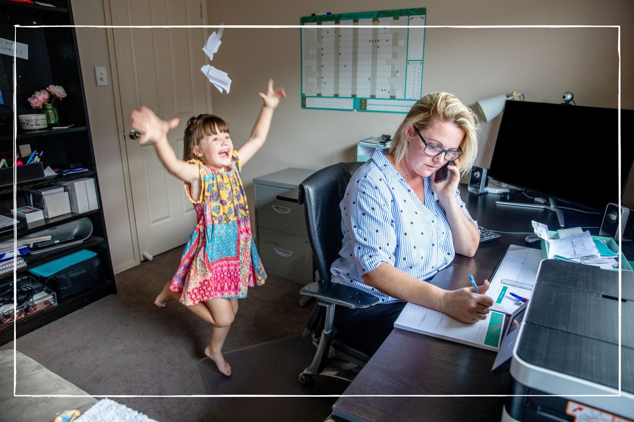 Mum trying to work from home while child plays in room behind her