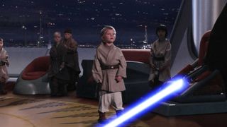 Anakin Skywalker faces younglings with lightsaber ready