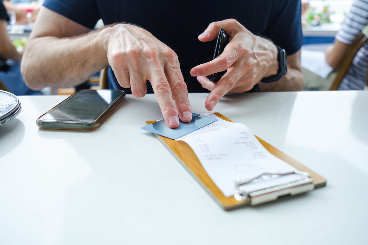 Man preparing to pay bill